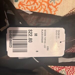 Dress tags still on it shorter in front
